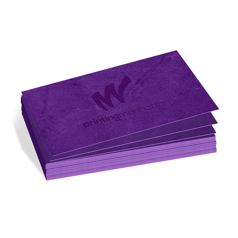 Stack of purple velvet business cards with debossed logo