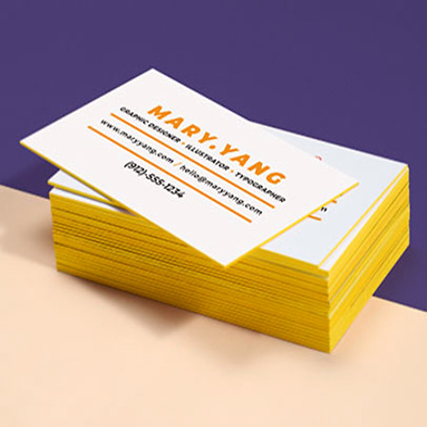 White Mary Yang business cards with bright yellow painted edges
