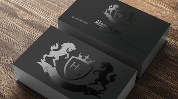 Black spot UV business cards with a gloss crest and horse emblem