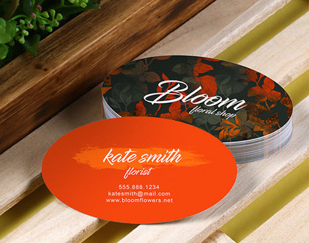 Oval florist business cards in orange with a floral back