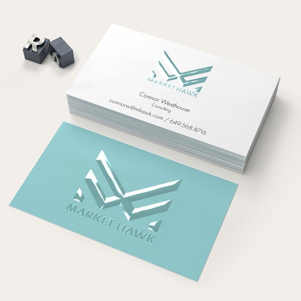 Market Hawk consulting cards with a raised gloss eagle logo on teal
