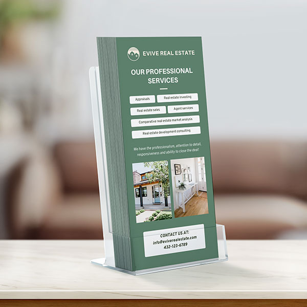 Green real estate rack cards in a countertop dispenser