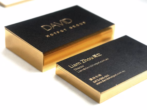 Premium foil-stamped business cards with metallic gold detailing